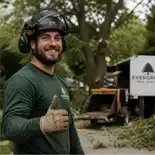 Arborist worker with chainsaw